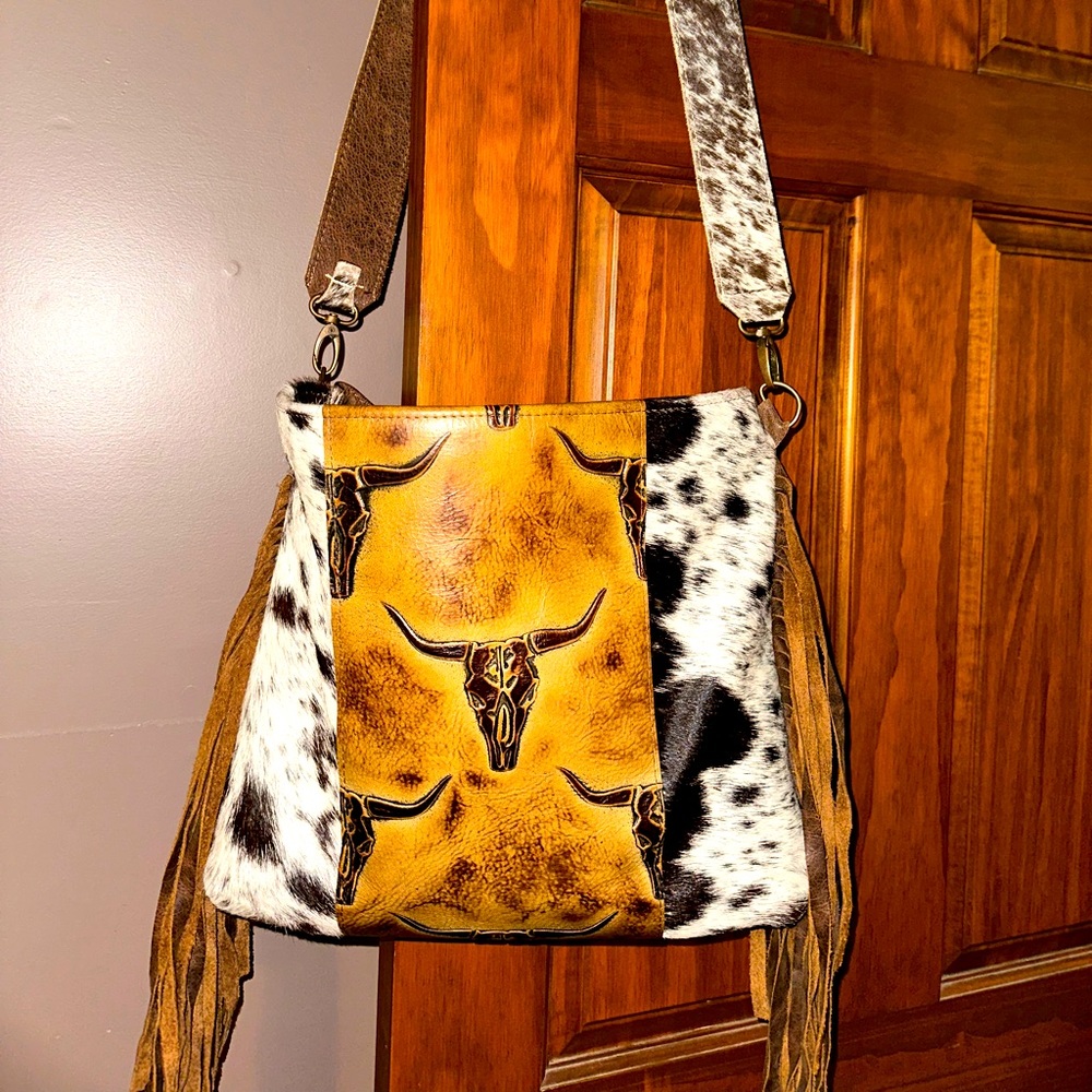 Leather cowhide crossbody bag.